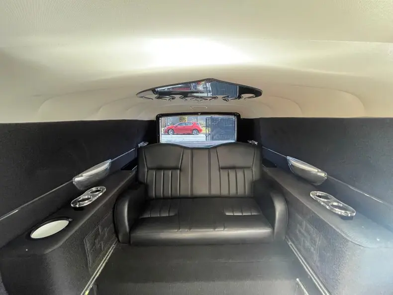 1972 Cadillac Superior Hearse Limousine inside rear, front-facing bench seat