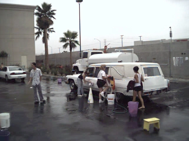 1976 Cadillac Superior Hearse Combo getting washed before the Guinness World Book of Records Longest Hearse Procession attempt October 7 2000