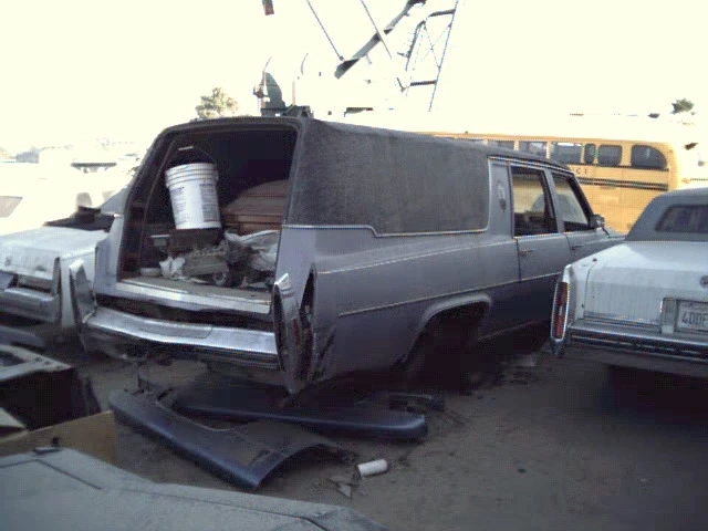 1978 Cadillac S&S Hearse with rear end damage.