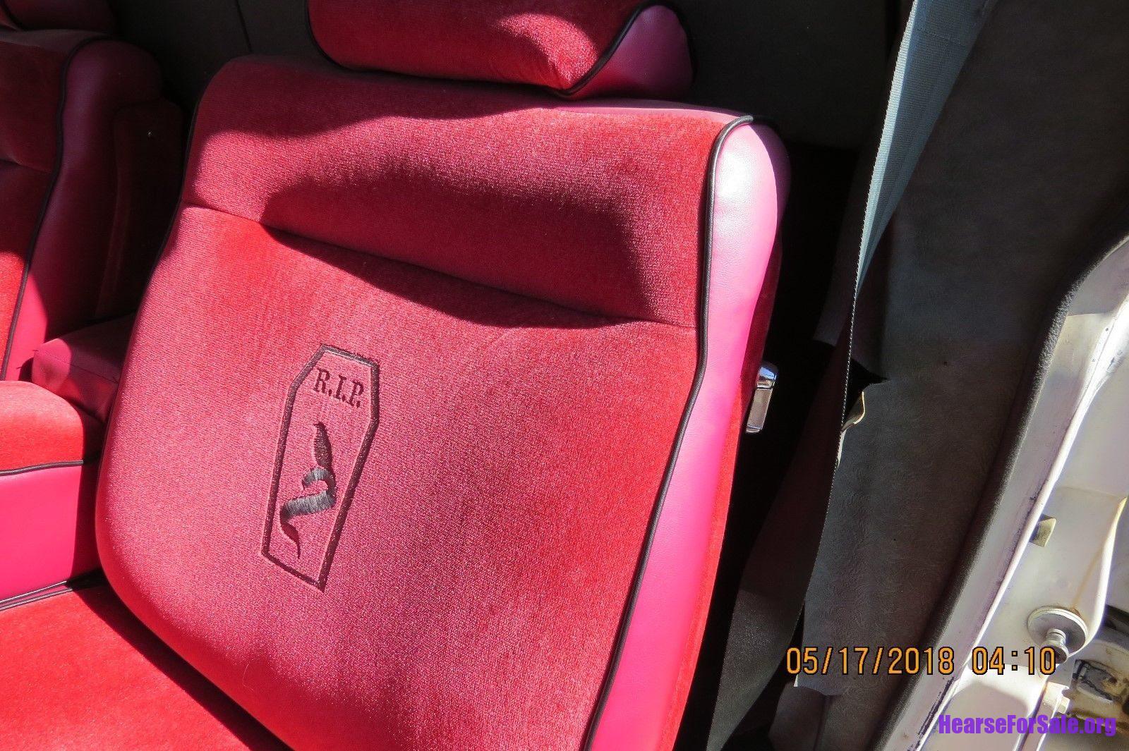 1972 Cadillac Superior Hearse with custom red upholstery with embroidered coffin and "R.I.P."