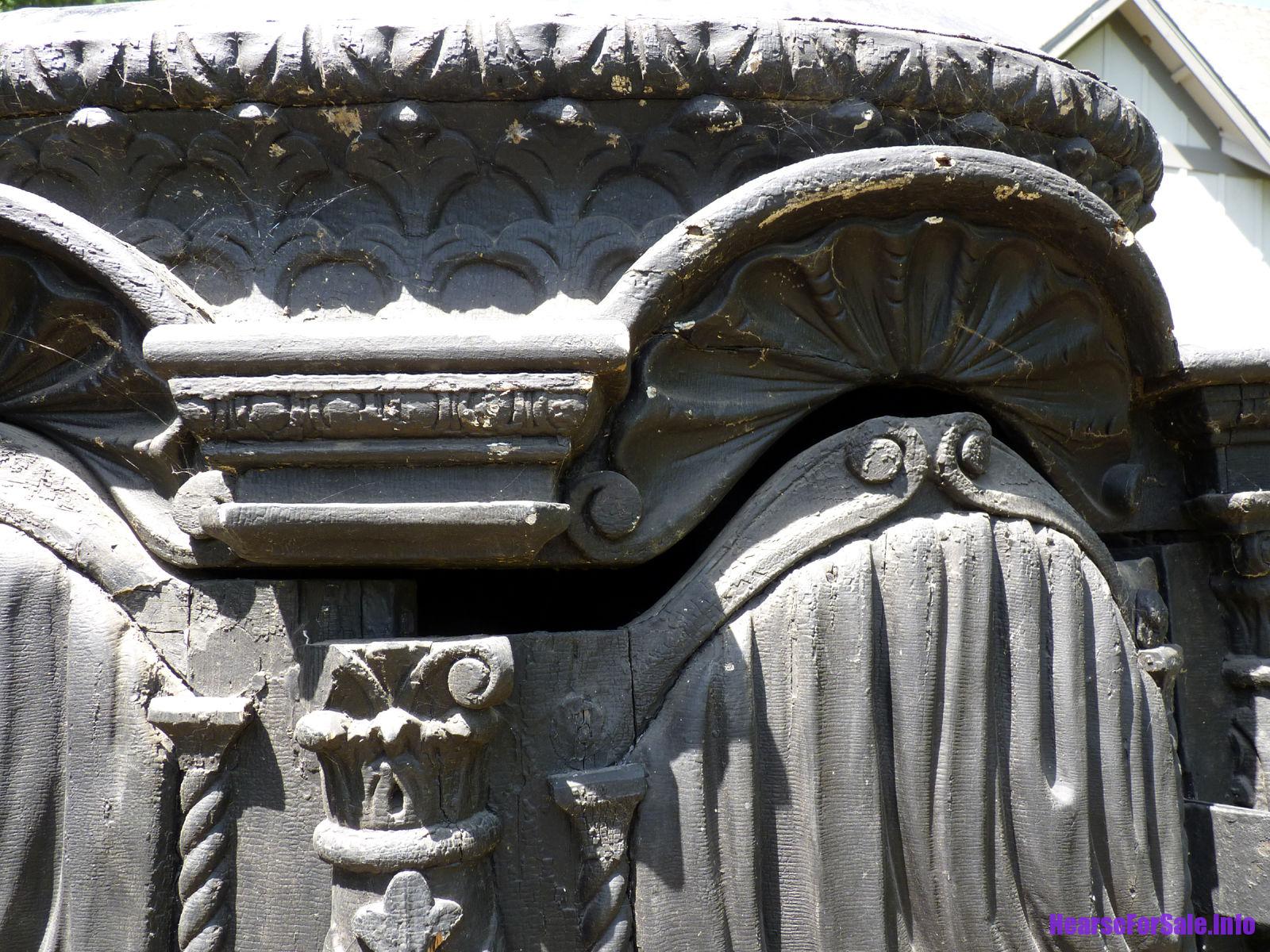1875 Hand-carved Horse-drawn Hearse for a child or maiden. Carved wood close-up.