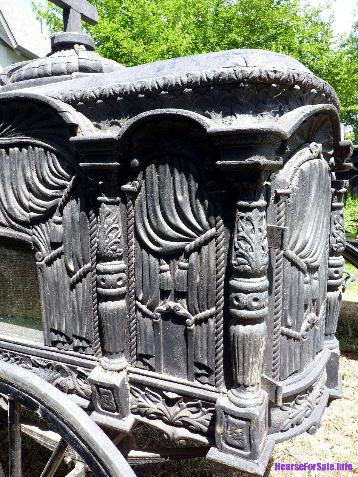 1875 Hand-carved Horse-drawn Hearse for a child or maiden. Carved wood side panels.