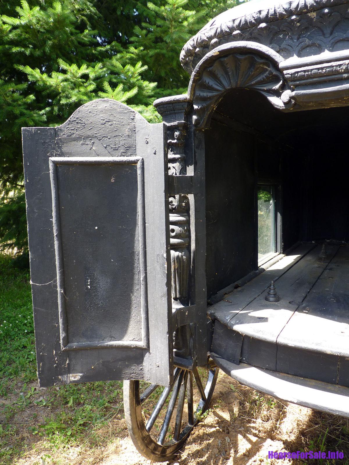 1875 Hand-carved Horse-drawn Hearse for a child or maiden. Rear door open.