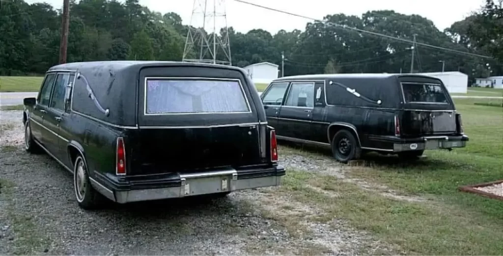 1985 Cadillac Hearses pair rear driver side quarter view