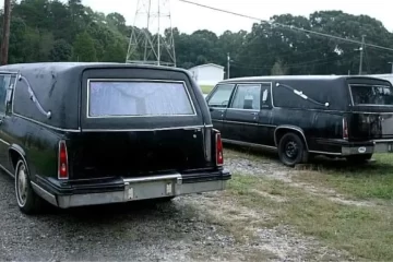 1985 Cadillac Hearses pair rear driver side quarter view