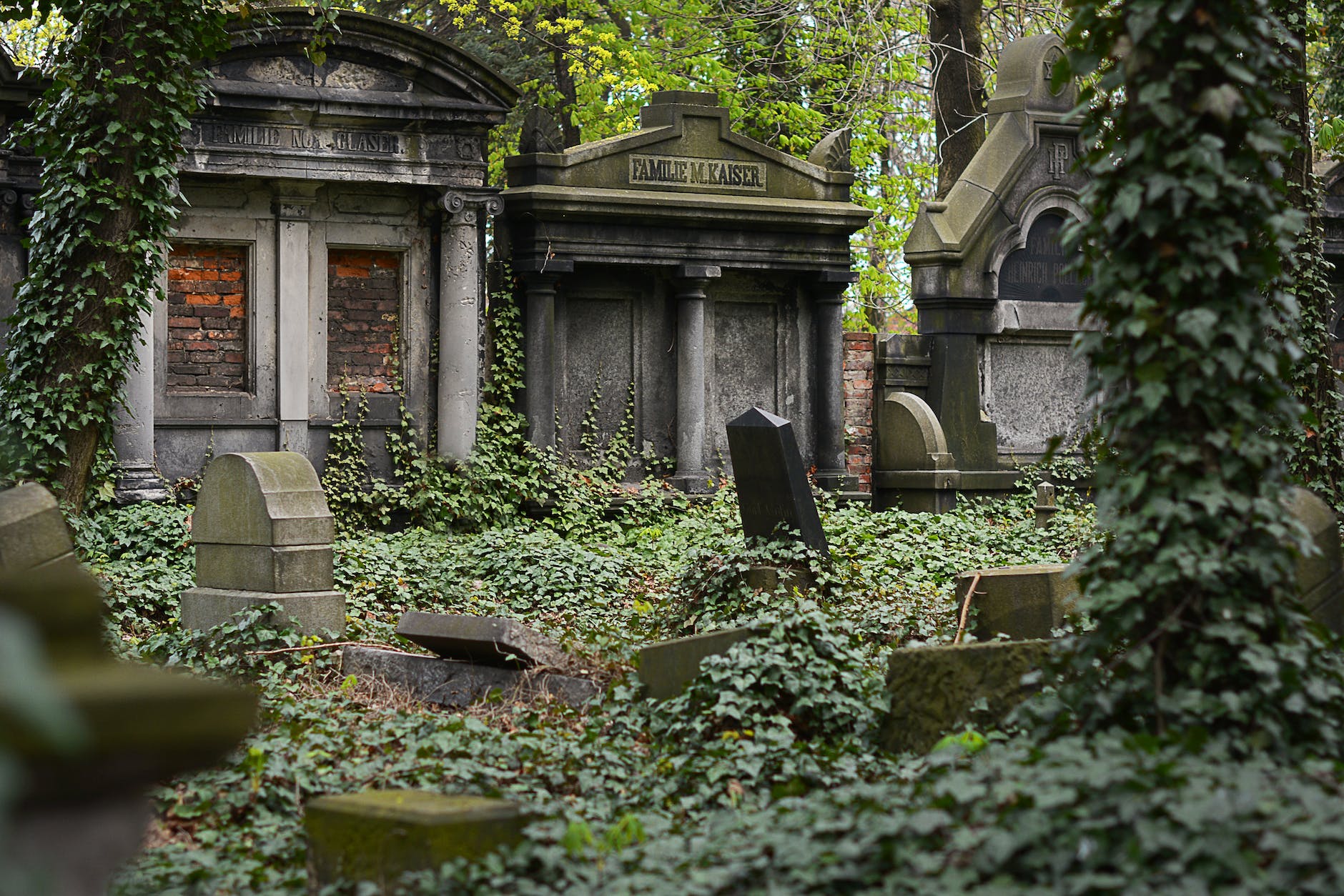 cemetery with headstones and mausoleums